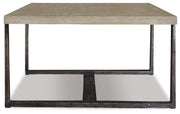 Ashley Furniture Dalenville coffee table with a sleek wooden top and modern design, shown in a stylish living room setting.