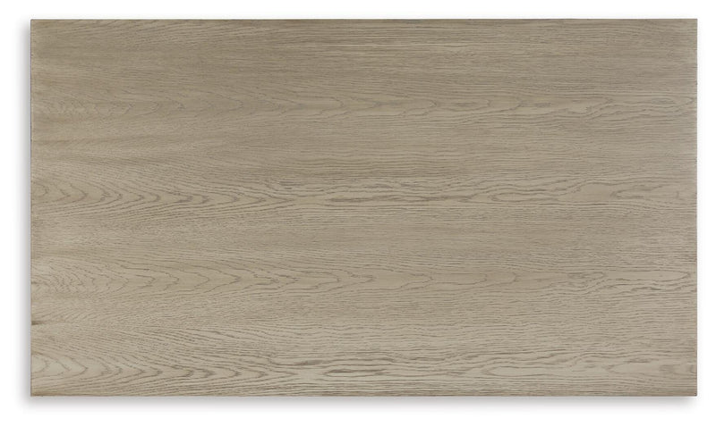 Ashley Furniture Dalenville cocktail coffee table with a sleek wooden top and modern design, shown from a top view.