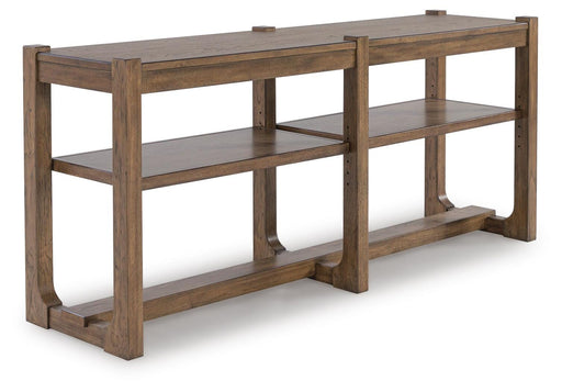 Ashley Furniture Cabalynn sofa table with a sleek wooden surface and modern design, shown from an angled side view.