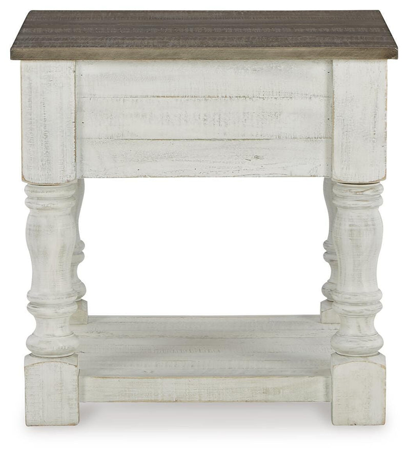 Ashley Furniture Havalance End Table with dark wood finish, featuring a sleek design and storage drawer, shown in the image.