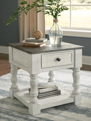 Ashley Furniture Havalance end table with a dark wood finish and modern design, featuring a smooth tabletop and sturdy legs.