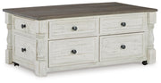 Ashley Furniture Havalance occasional table set featuring two stylish tables with sleek wood finishes and modern design.