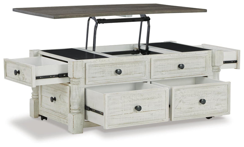 Ashley Furniture Havalance occasional table set featuring two modern tables with sleek wood finishes and metal legs.