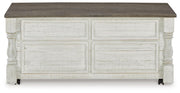 Ashley Furniture Havalance Occasional Table Set featuring three modern tables with dark wood finish and sleek metal legs.