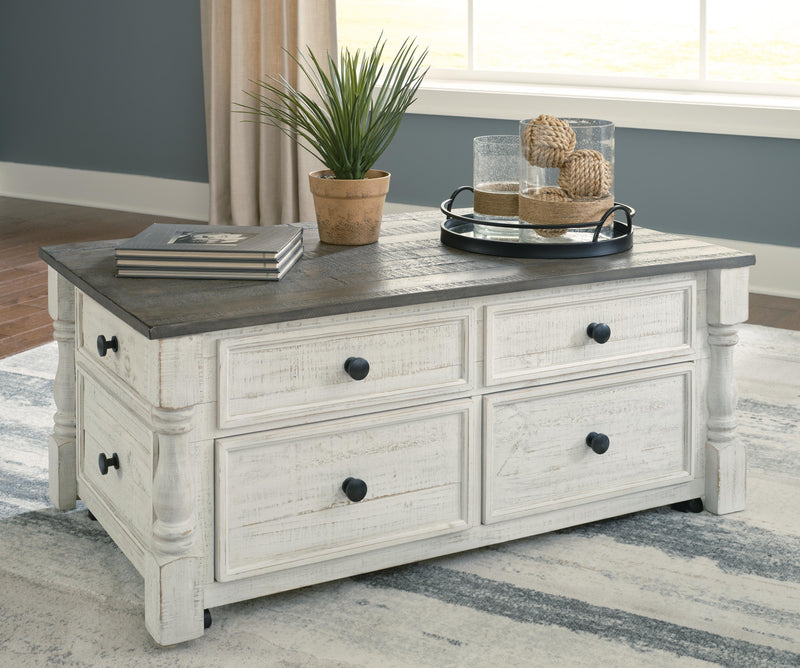 Ashley Furniture Havalance lift-top coffee table with a sleek wooden finish and hidden storage, shown in closed position.