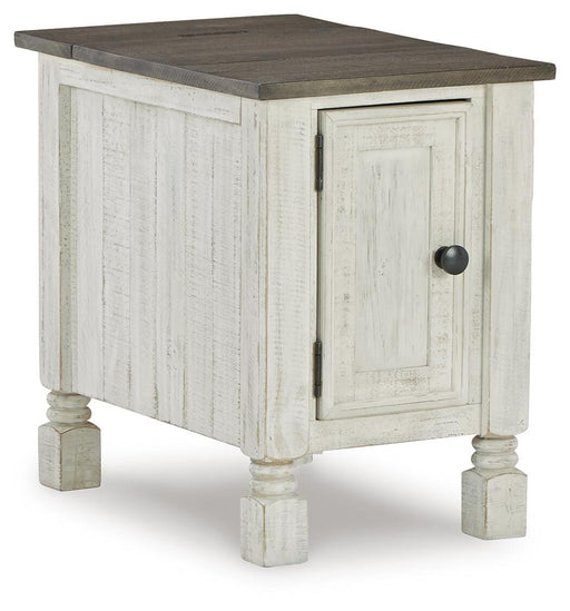 Ashley Furniture Havalance chairside end table with a wooden top and storage drawer, shown from an angled side view.