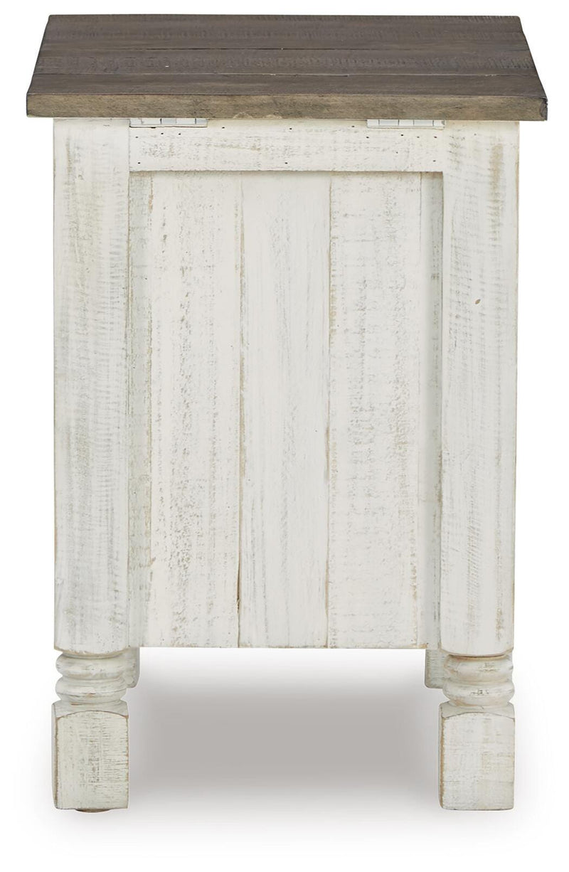 Ashley Furniture Havalance chairside end table with a modern design, featuring a dark wood finish and a compact, functional surface.