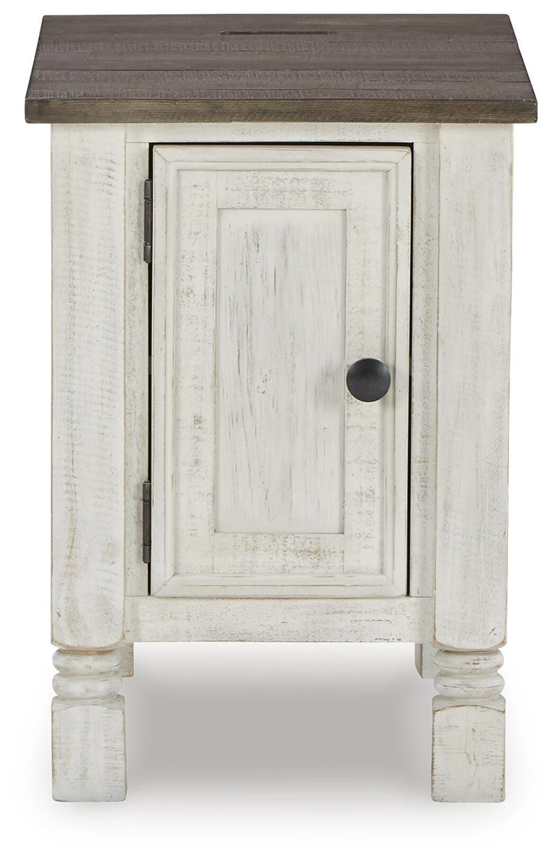 Ashley Furniture Havalance chairside end table with a dark wood finish and a single drawer, shown from a head-on angle.