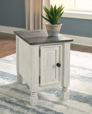 Ashley Furniture Havalance chairside end table with wood finish and modern design, featuring a compact tabletop and storage drawer.