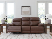 Ashley Furniture VonRyan power reclining sofa with plush seats and adjustable headrests, shown in a modern living room setting.
