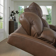 Ashley Furniture VonRyan power reclining loveseat with plush upholstery and padded armrests, ideal for relaxing comfort.
