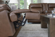 Ashley Furniture VonRyan power reclining sofa with plush upholstery and padded armrests, perfect for relaxing comfort.