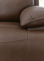 Ashley Furniture VonRyan Power Reclining Sofa showing stitched upholstery and plush seating in a modern living room setting.