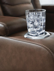 Ashley Furniture high impact power recliner with plush upholstery and modern design, featuring a comfortable reclining mechanism.