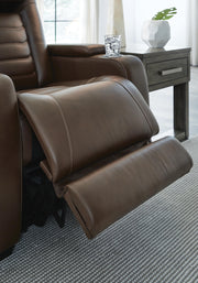 Ashley Furniture high impact power recliner with plush upholstery and modern design, shown in a comfortable reclined position.