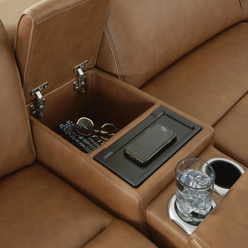 Close-up of Ashley Furniture Magic Man 5-piece power reclining sectional showcasing plush fabric and reclining seats.