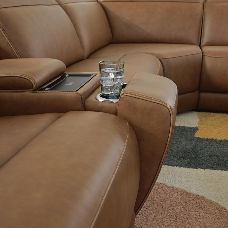 Ashley Furniture Magic Man 5-Piece Power Reclining Sectional with plush fabric and adjustable reclining seats in a modern living room setup.