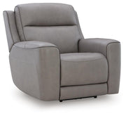Ashley Furniture 5Z-Comfort Power Recliner with plush cushioning, side control panel, and dark brown upholstery, viewed from an angle.