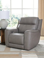 Ashley Furniture 5Z-Comfort Power Recliner in dark brown fabric with plush cushioning and built-in reclining mechanism.