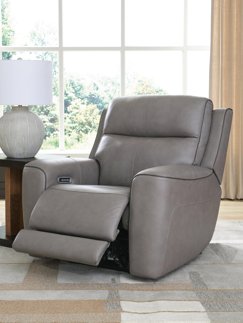 Ashley Furniture 5Z-Comfort Power Recliner in open position, showcasing plush fabric upholstery and padded armrests.