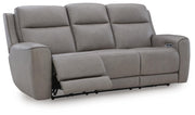 Ashley Furniture 5Z-Comfort Power Reclining Sofa shown from an open angle, featuring plush cushions and reclining mechanism.