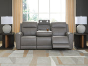 Ashley Furniture 5Z-Comfort Power Reclining Sofa with plush cushions and reclining features, shown in a cozy living room setting.