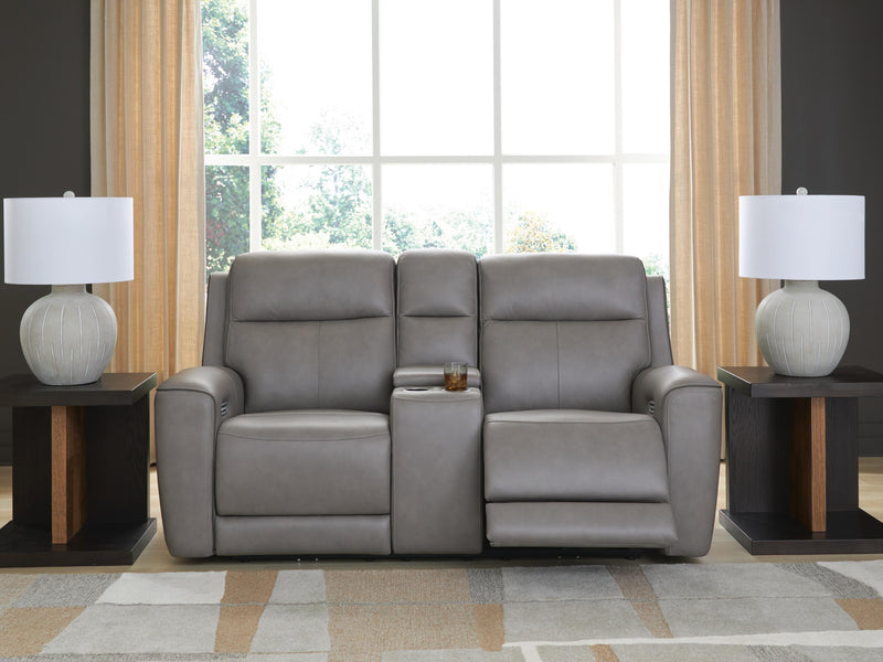Ashley Furniture 5Z-Comfort Power Reclining Loveseat with Console, featuring plush fabric and built-in cup holders.