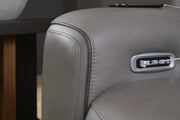 Ashley Furniture 5Z-Comfort power reclining loveseat with console, showing stitched and welt detail in a cozy fabric finish.