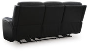Ashley Furniture 5Z-Comfort Power Reclining Sofa showing plush upholstery and reclining features in a modern living room setting.