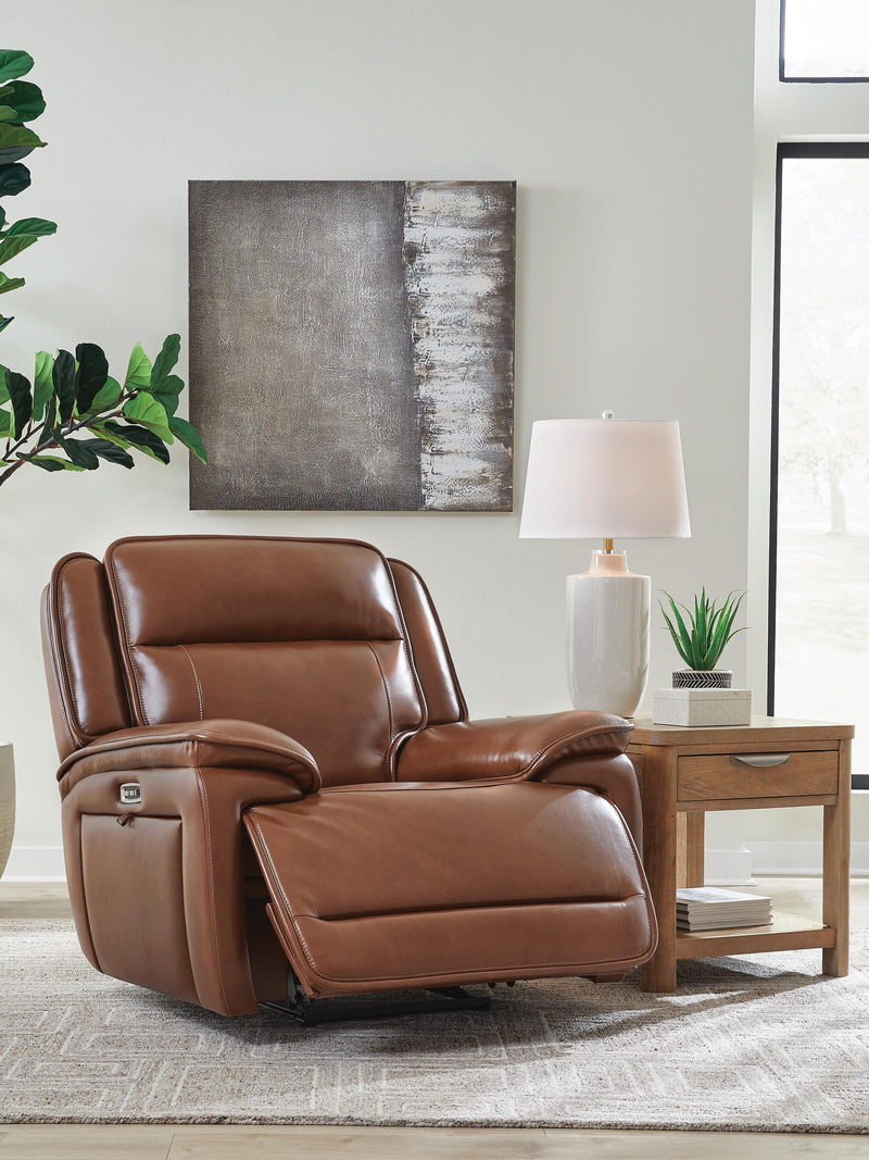 Ashley Furniture Healy Pier Power Recliner shown from an angled open view, featuring plush cushioning and a sturdy wooden base.