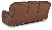 Ashley Furniture Healy Pier Power Reclining Sofa with plush back cushions and reclining footrests, shown from the back.