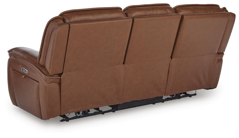 Ashley Furniture Healy Pier Power Reclining Sofa with plush back cushions and reclining footrests, shown from the back.