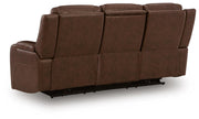 Ashley Furniture Knightington living room set with sofa and armchair, shown from the back with dark upholstery and wooden legs.