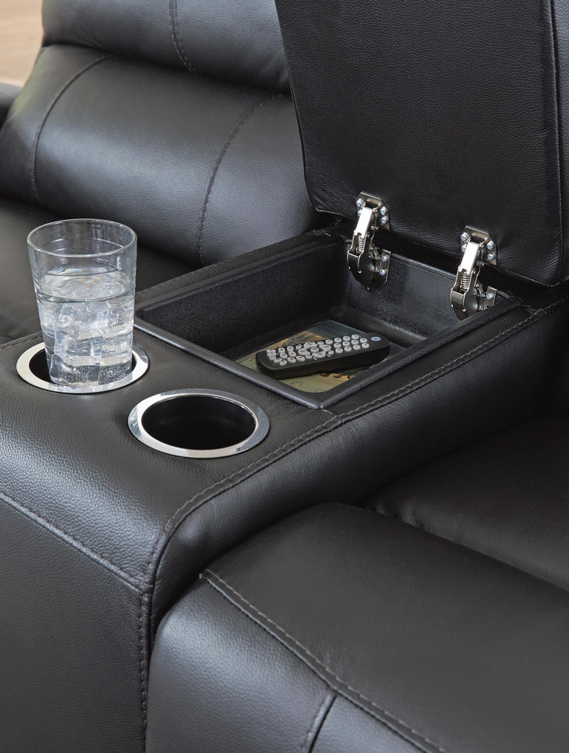 Close-up of Ashley Furniture Glossmore living room set reclining console with detailed stitching and dark upholstery.