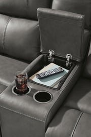 Close-up of the Ashley Furniture Bleckley Reclining Living Room Set with detailed armrest and reclining mechanism.