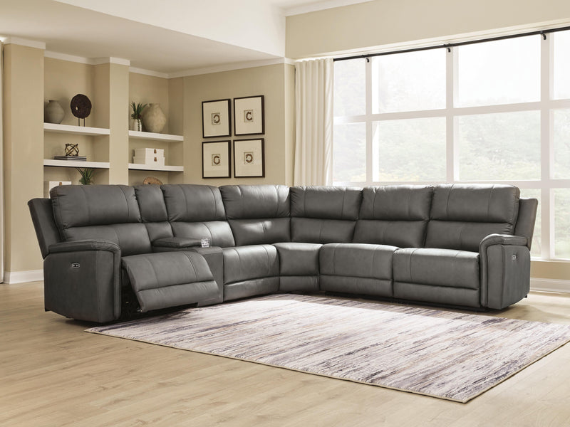 Ashley Furniture Bleckley power reclining sectional with plush cushions and dark upholstery, shown in a modern living room setting.