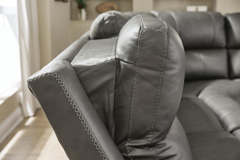 Ashley Furniture Bleckley power reclining sectional with plush cushions and reclining seats, shown in a modern living room setting.