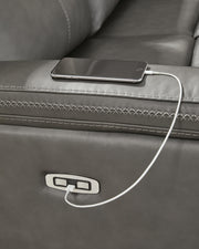 Ashley Furniture Bleckley power reclining sectional with USB ports, featuring plush cushions and a modern design in a neutral fabric.