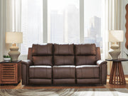 Ashley Furniture Bleckley reclining living room set with plush fabric cushions and wide armrests, shown in a cozy living space.