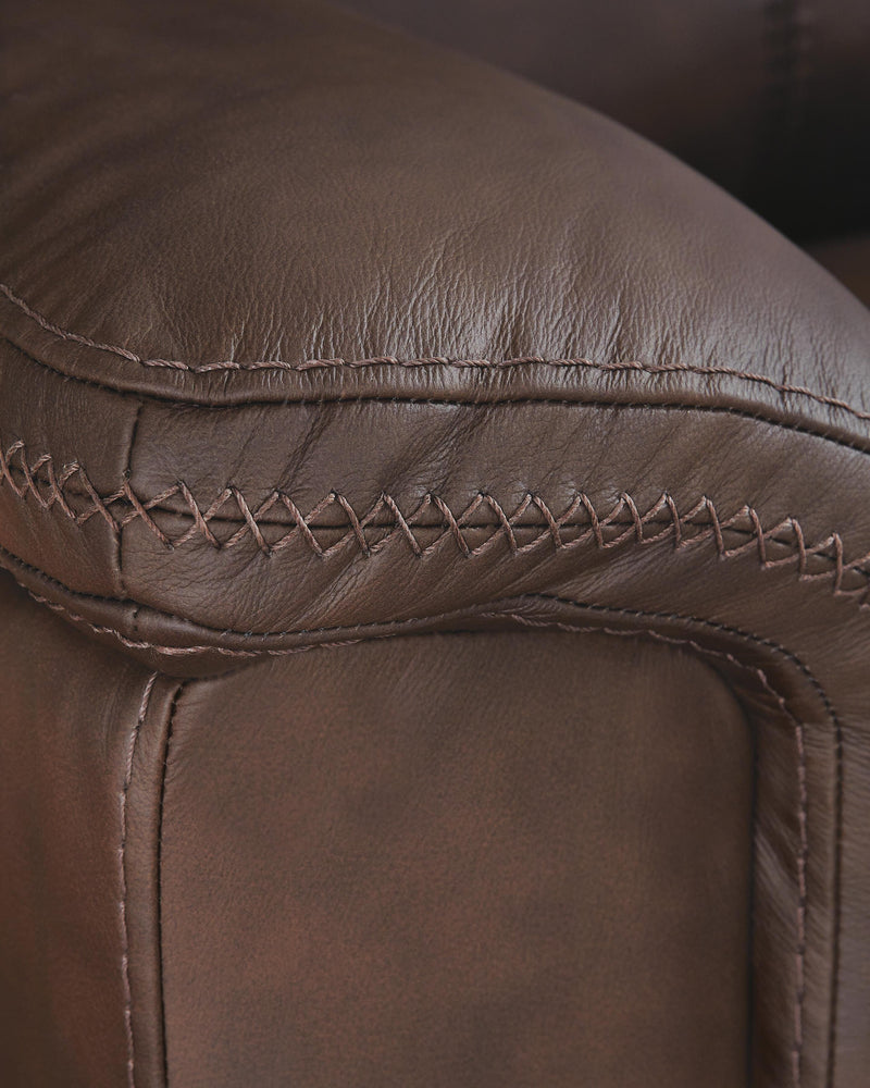 Ashley Furniture Bleckley power reclining sofa with plush upholstery and stitched detailing, designed for comfortable lounging.