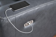 Ashley Furniture Next Move Power Reclining Sofa with USB port, showing plush fabric, padded armrests, and reclining mechanism.