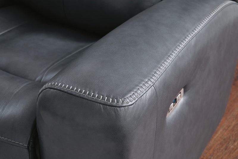 Ashley Furniture Next Move power reclining loveseat with stitched fabric detail, plush cushions, and reclining mechanisms visible in the image.