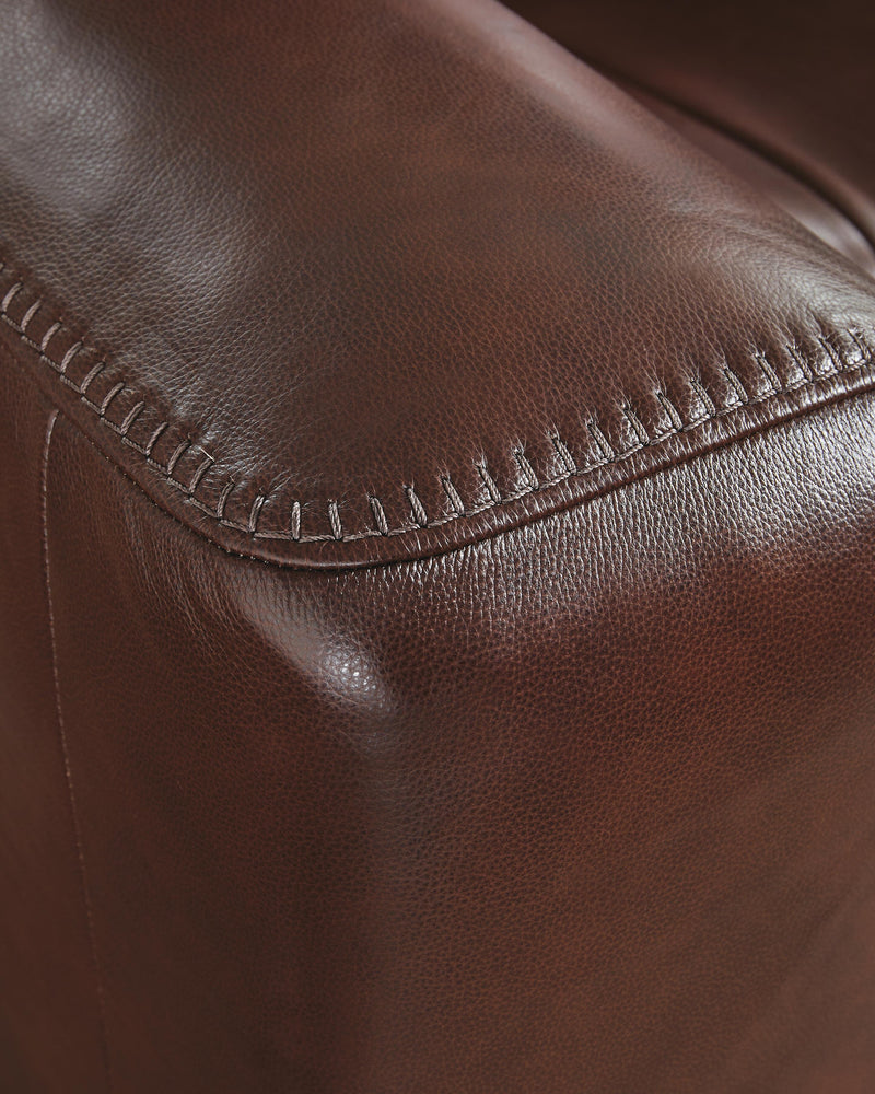 Ashley Furniture Next Move power reclining sofa with stitched detail, showcasing plush cushions and reclining mechanism.