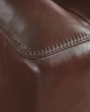 Ashley Furniture Next Move power reclining loveseat with console, featuring stitched upholstery and plush seating for comfort.