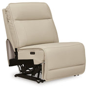 Ashley Furniture Double Deal Reclining Sectional shown from an angle, featuring plush cushions and reclining seats in a modern design.