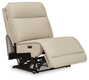Ashley Furniture Double Deal Reclining Sectional shown from an angled open view, featuring plush cushions and reclining seats.