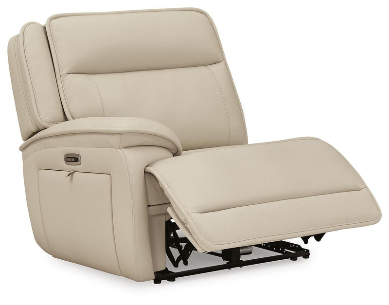 Ashley Furniture Double Deal Reclining Sectional shown from an angle with open chaise and plush cushions in modern living room setting.