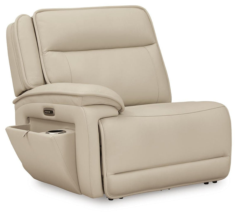 Ashley Furniture Double Deal reclining sectional with console, showing open seats and plush cushions from an angled side view.
