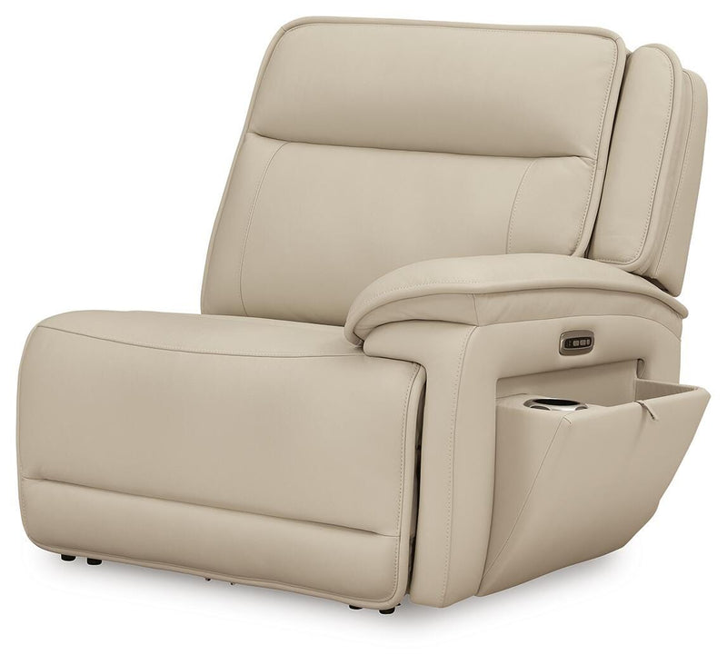 Ashley Furniture Double Deal Reclining Sectional showing angled view with open chaise and plush cushions in a modern living room setting.