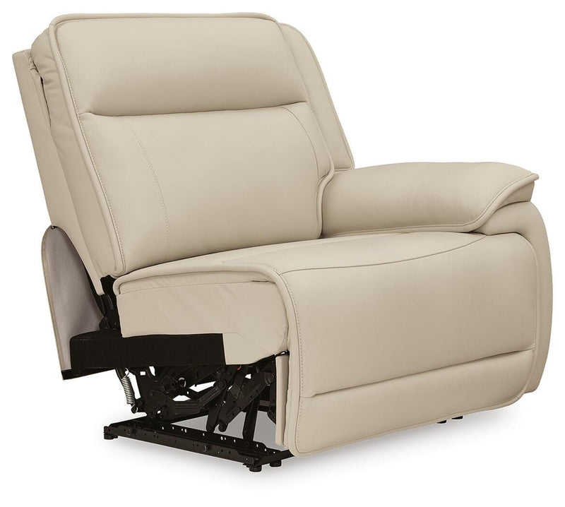 Ashley Furniture Double Deal reclining sectional sofa with plush cushions, shown from an angled side view.